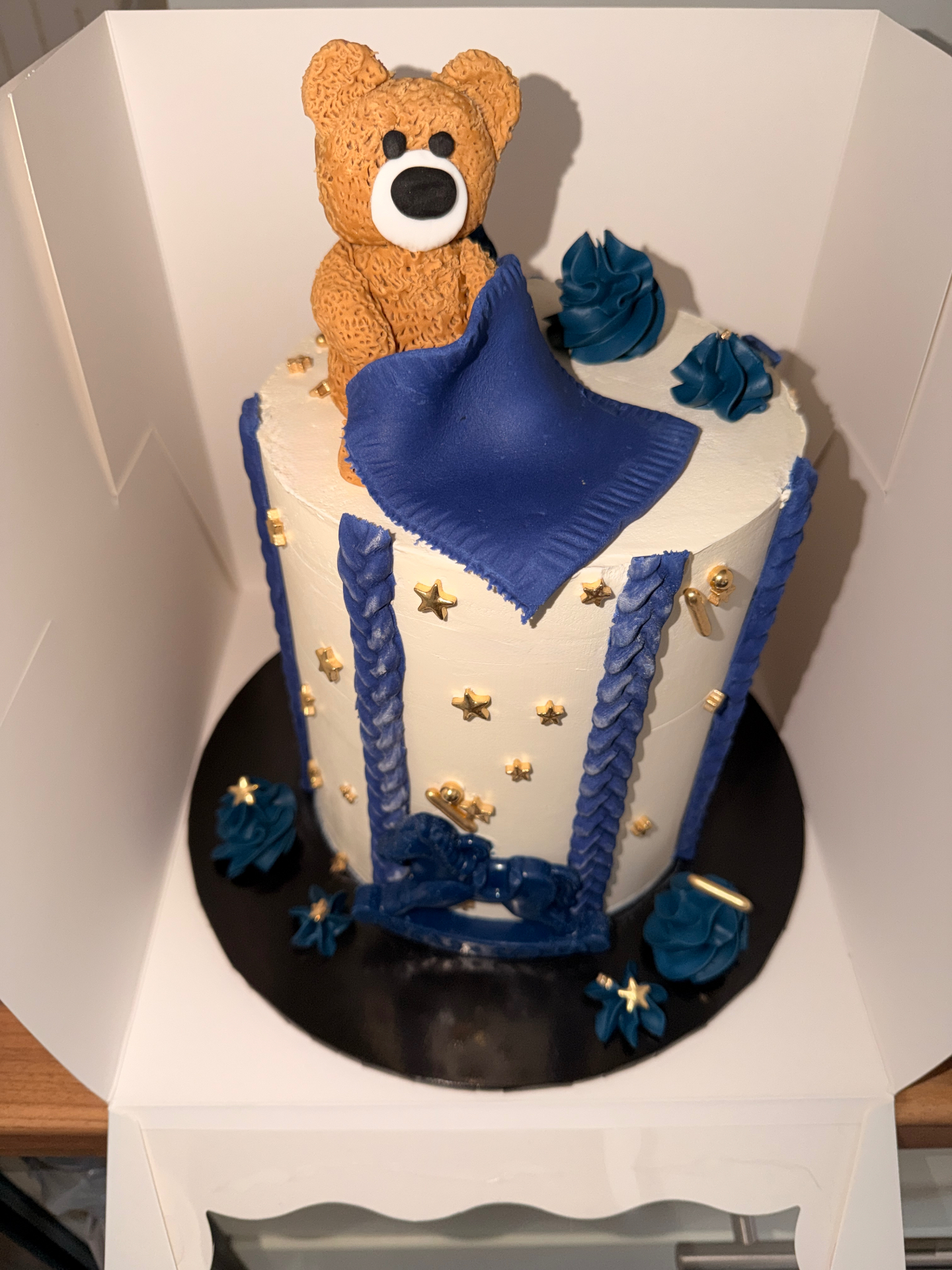 Navy and gold teddy bear celebration cake with star detail